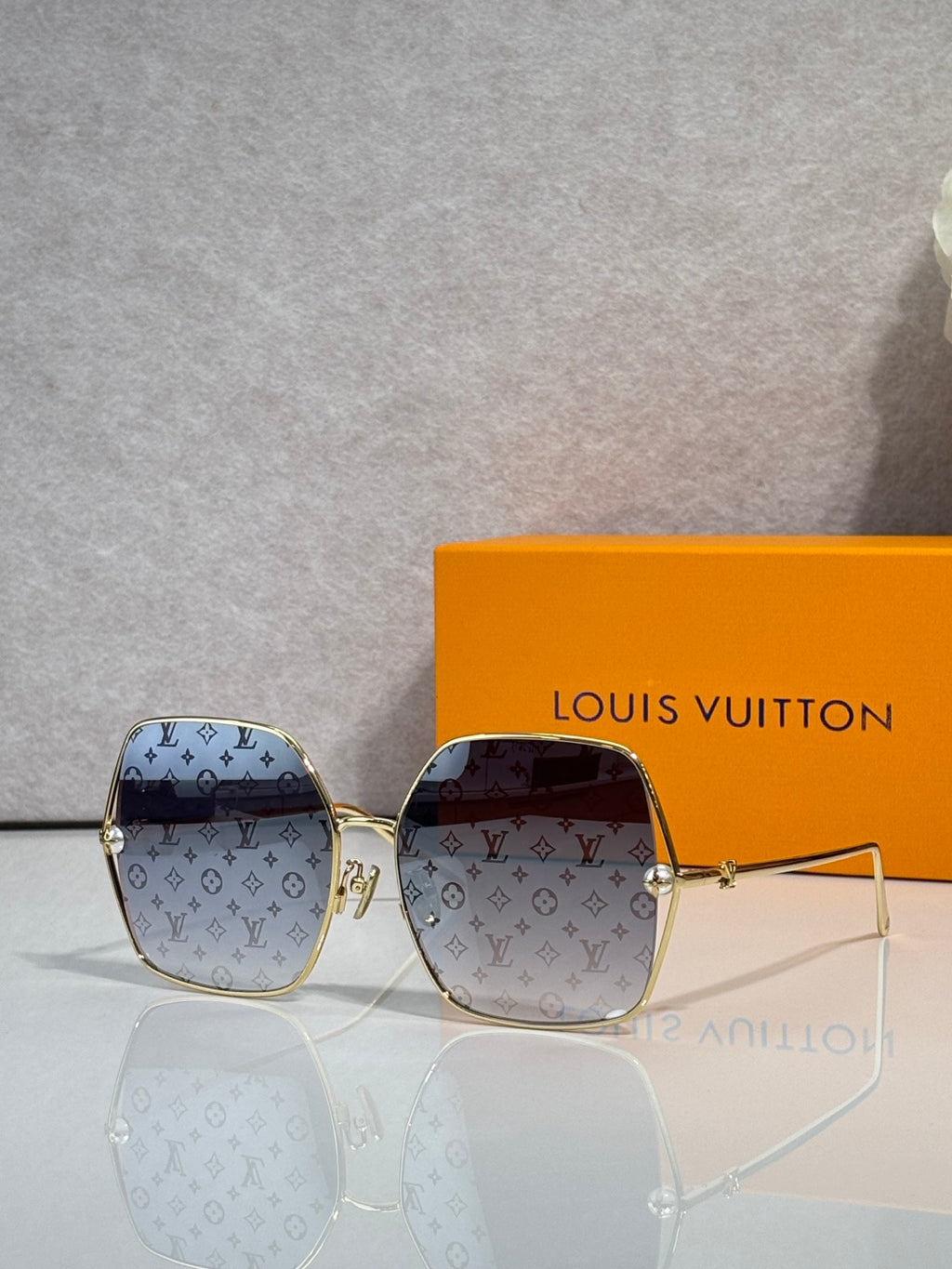Louis Vuitton monogram square sunglasses with brown patterned frame and tinted lenses