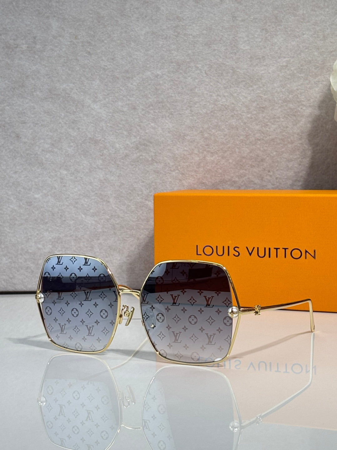 Louis Vuitton monogram square sunglasses with brown patterned frame and tinted lenses