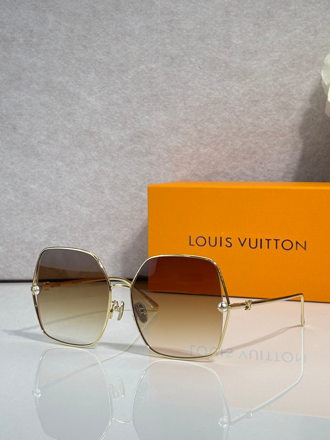 Louis Vuitton square sunglasses with gradient tinted lenses and gold-tone frame