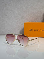Louis Vuitton sunglasses with pink tinted lenses and gold-tone metal frame