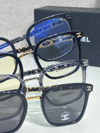 Chanel eyeglasses side-by-side with dark frames and gold chain temple details