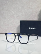Chanel dark blue rectangular eyeglasses with gold chain temple hardware