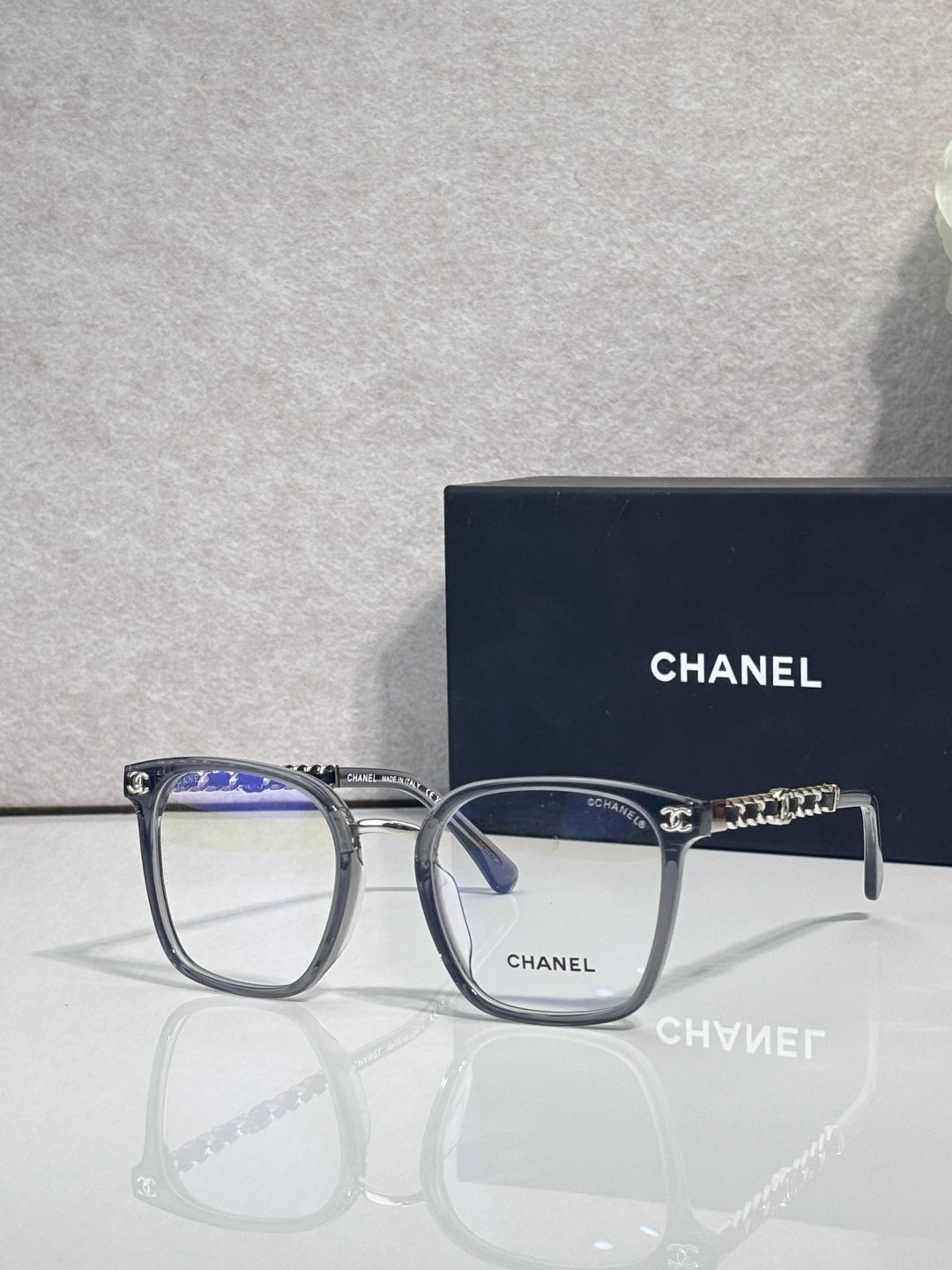 Chanel dark blue square eyeglasses with gold-tone chain temple accents