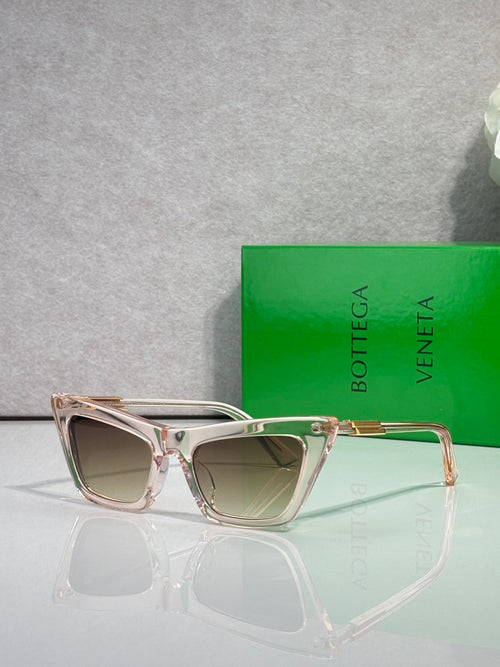 Bottega Veneta sunglasses with pale pink and silver frames, tinted light lenses