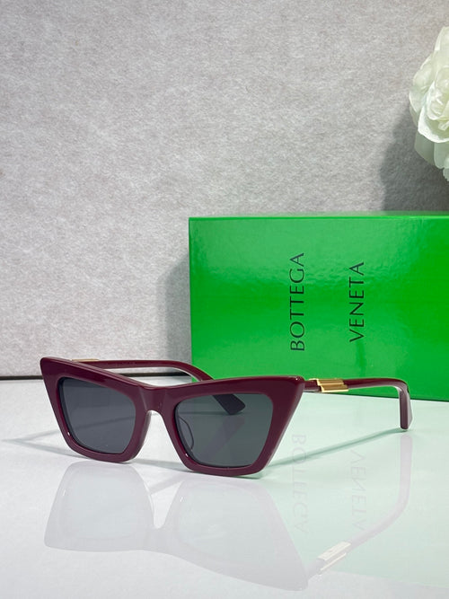 Bottega Veneta sunglasses, maroon frame with green temple tips, dark lenses