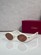 Round eyeglasses with cream frames and brown-tinted lenses