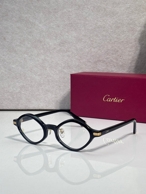Round eyeglasses with dark blue-black frames and gold-tone bridge detail