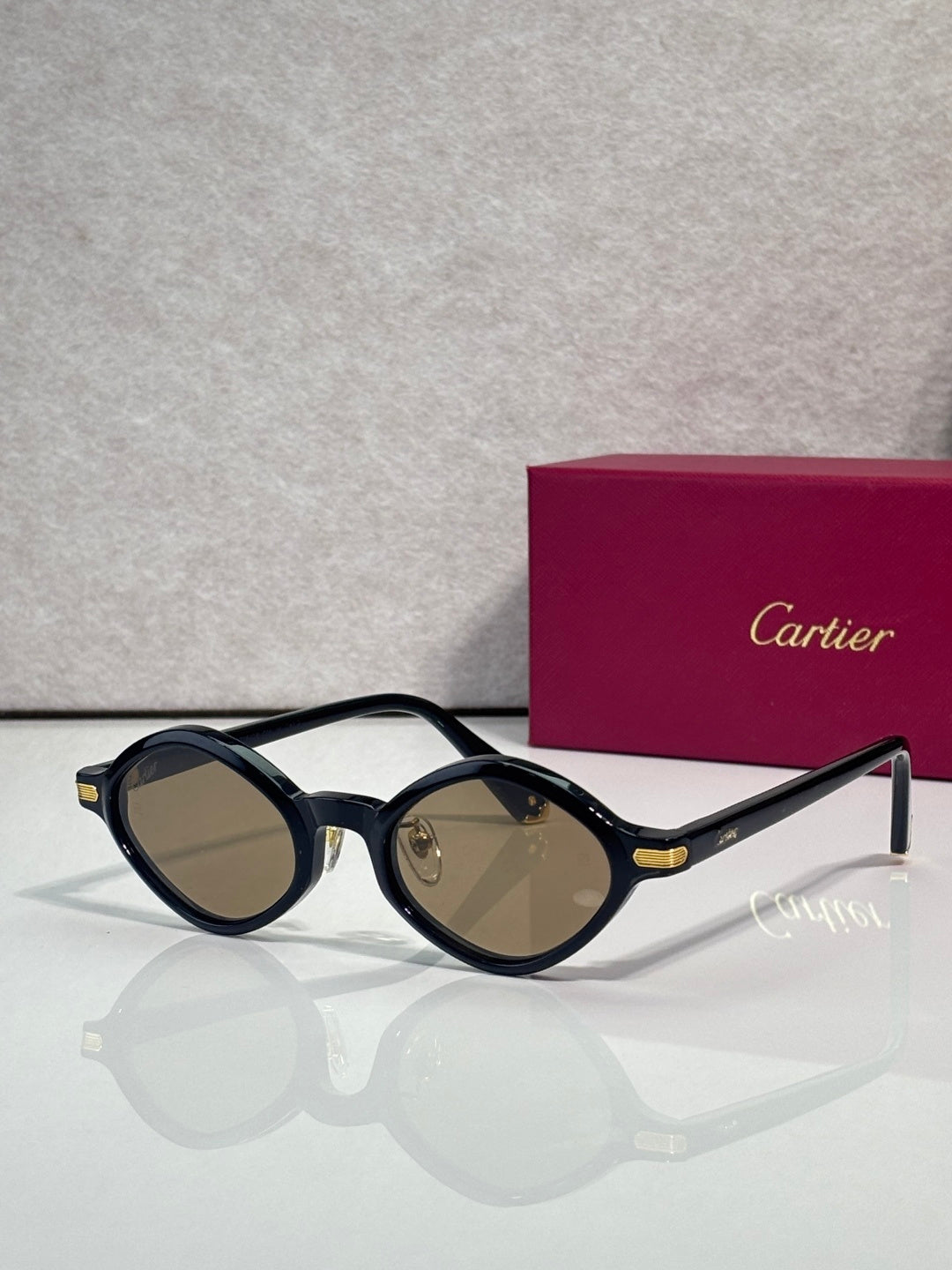 Round eyeglasses with dark blue-black frames and olive-tinted lenses