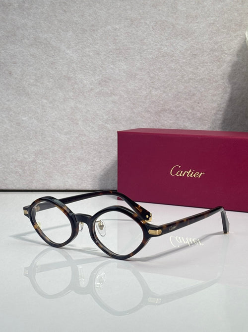Round eyeglasses with dark blue-black frames and gold-tone temple accents