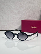 Round eyeglasses with dark blue-black frames and smoky gray lenses