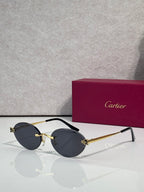 Dark round sunglasses with gold accents and black temples