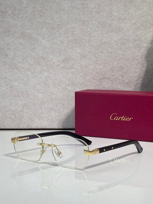 Cartier eyeglasses with clear frames and gold-tone accents, rectangular lenses