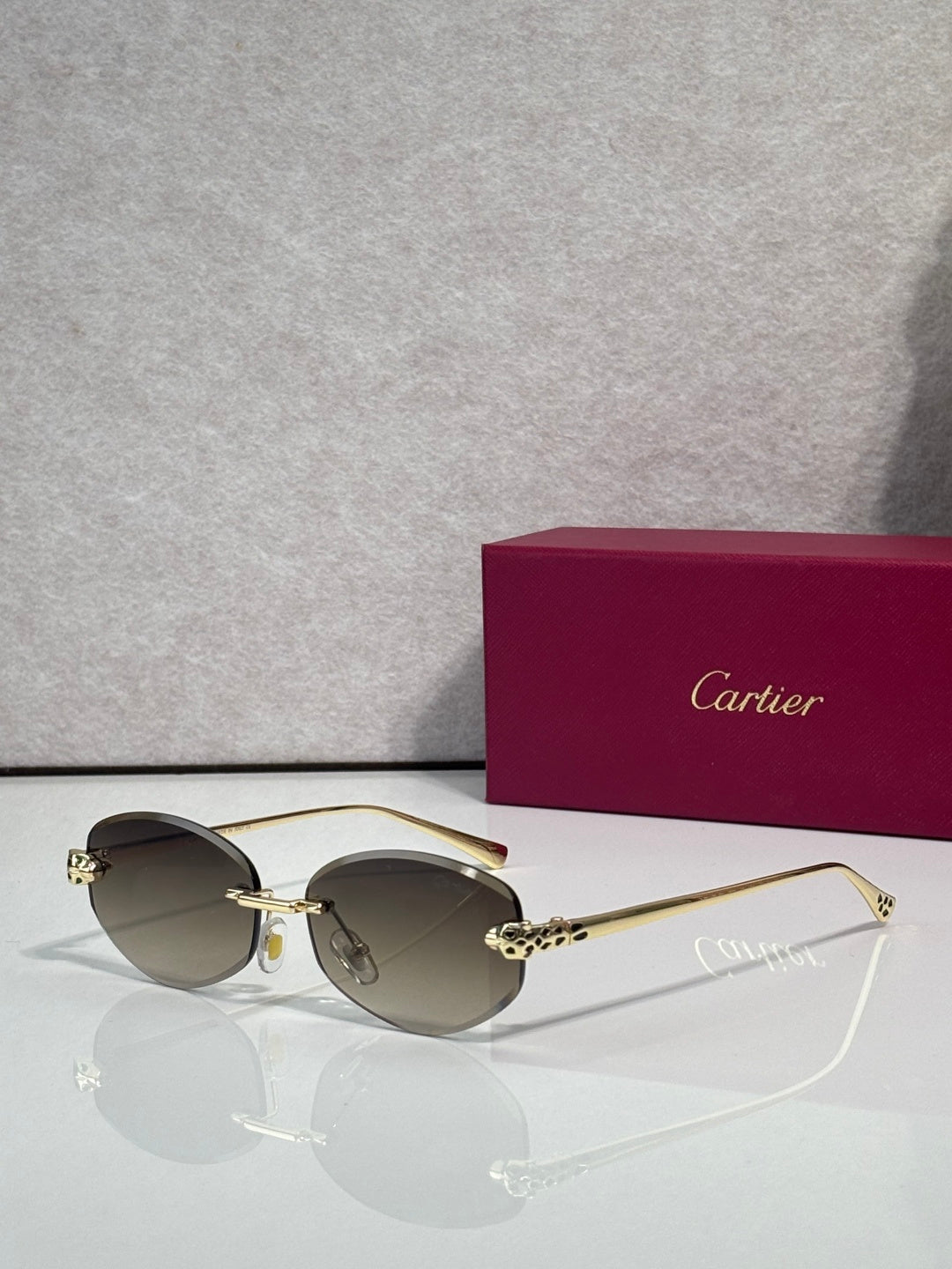 Cartier eyeglasses with brown-tinted lenses and gold-tone metal frame, round style