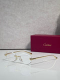 Cartier eyeglasses with clear lenses and gold-tone metal frame, round silhouette