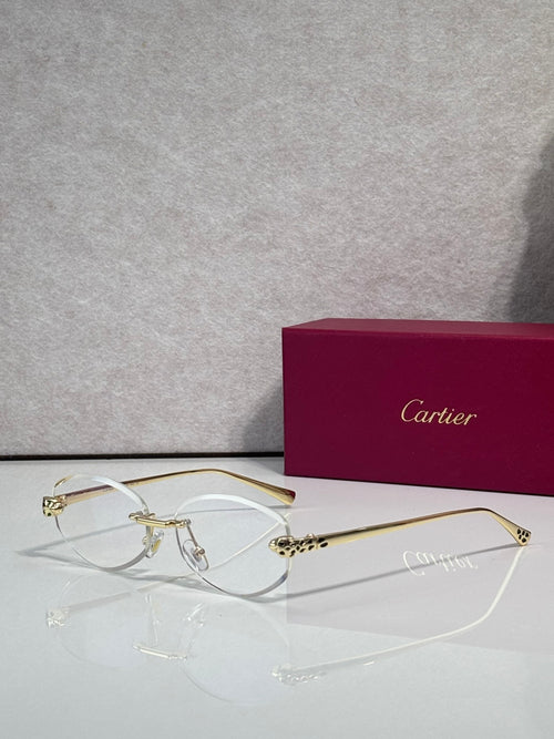 Cartier eyeglasses with clear lenses and gold-tone metal frame, round silhouette