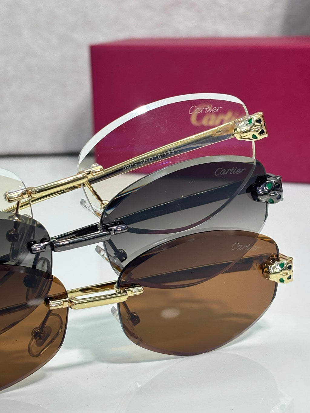 Cartier sunglasses side view with gold-tone frame and layered lens look, ornate top