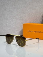 Louis Vuitton sunglasses with dark lenses and monogram-pattern frames in gold-tone.