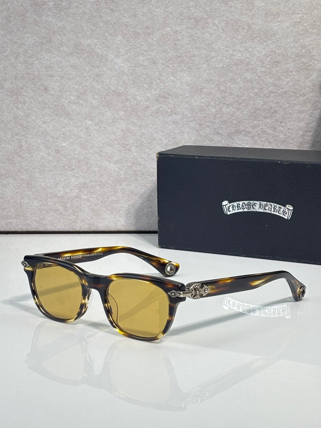 Tortoiseshell sunglasses with amber lenses and gold-tone temple accents