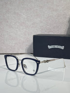 Dark blue eyeglasses with rectangular clear lenses and metal hinge hardware