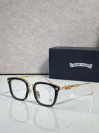 Gold eyeglasses with rectangular clear lenses, dark blue inner frame, and gold temples