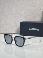 Round-corner square sunglasses with clear lenses, dark blue frame, gold temple detail, chrome trim