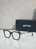 Green eyeglasses with gold metal temples and rectangular lenses