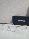 Clear eyeglasses with gold metal temples and rectangular frames