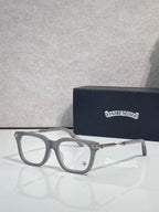 Light gray eyeglasses with gold metal temples and rectangular lenses