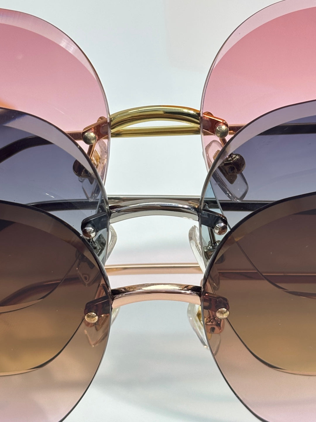 Louis Vuitton glasses with round mixed-tint lenses, gold and silver frame, front view