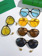 Bottega Veneta sunglasses set with five frames: yellow, amber, brown, and black with blue lenses.