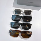 Assorted Balenciaga sunglasses lineup: white, blue, black, and tortoiseshell frames