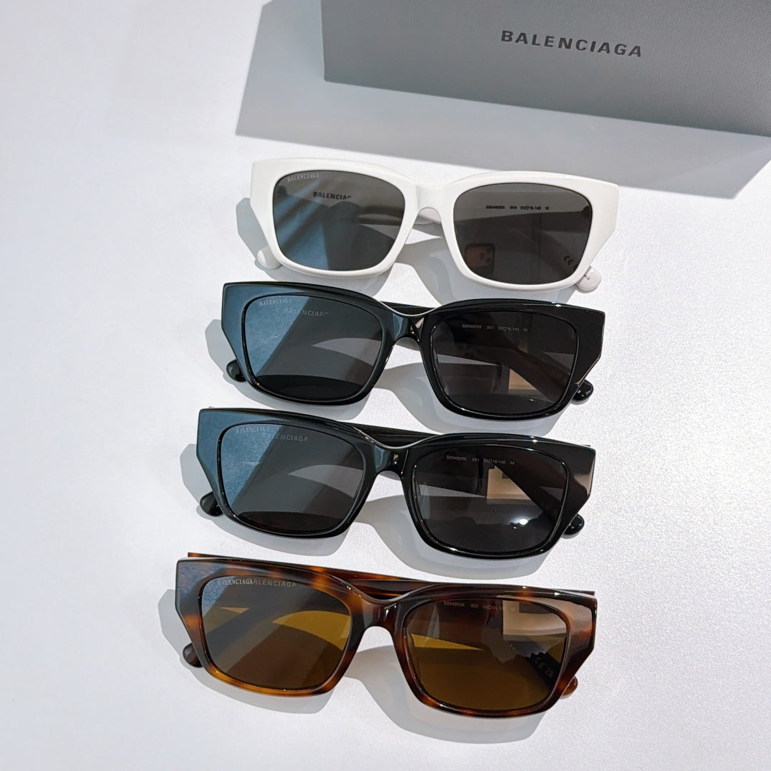 Assorted Balenciaga sunglasses lineup: white, blue, black, and tortoiseshell frames