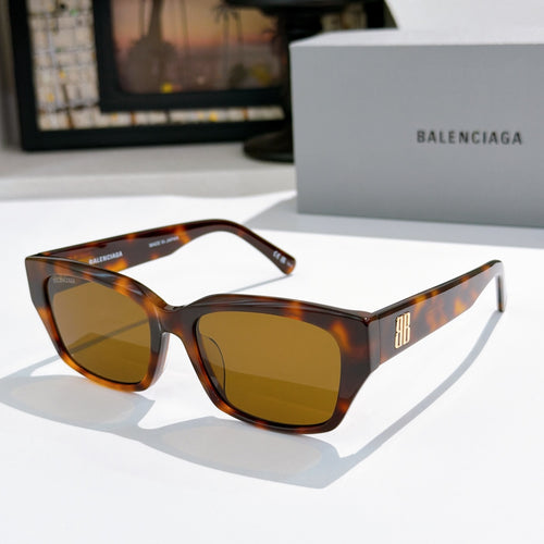 Balenciaga sunglasses with tortoiseshell frames and amber tinted lenses, cat-eye shape