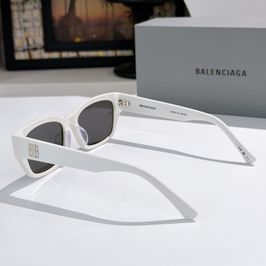 Balenciaga sunglasses side view with white frames and dark tinted lenses