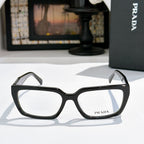Prada eyeglasses with black full-rim frame and clear lenses, front view