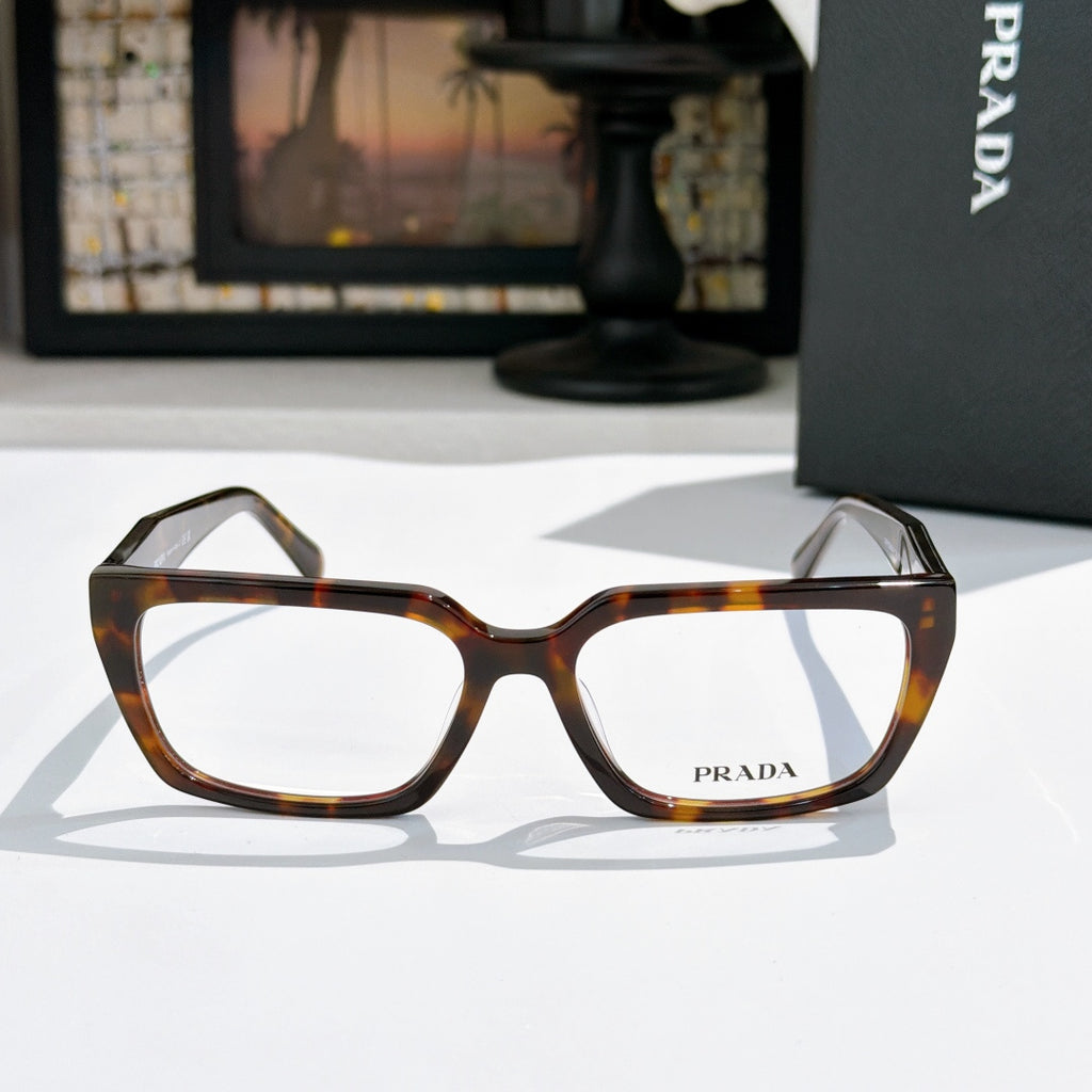 Prada eyeglasses with dark tortoiseshell full-rim frame and clear lenses