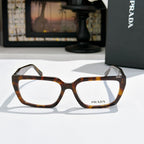 Prada eyeglasses with dark tortoiseshell full-rim frame and clear lenses