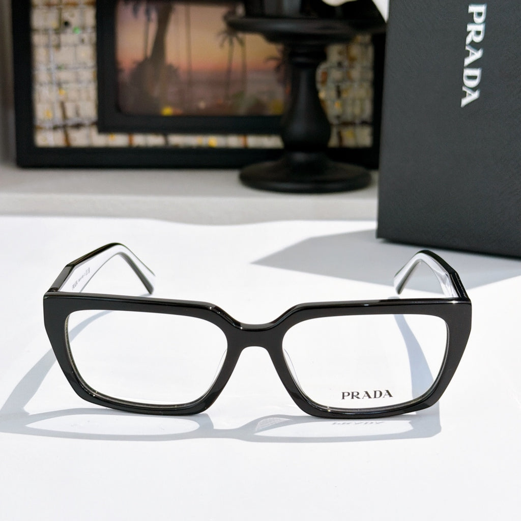 Prada eyeglasses with black full-rim frame and clear lenses, rectangular rounded shape