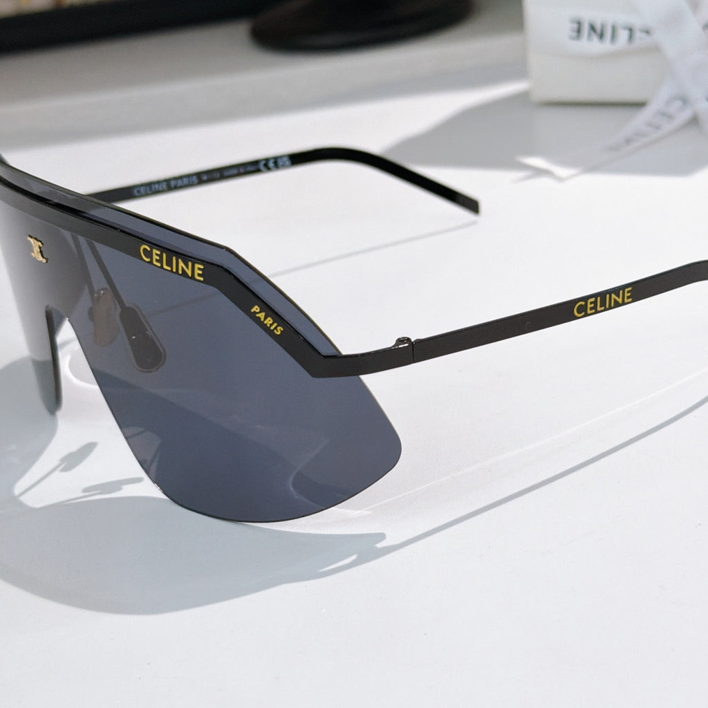 Celine shield sunglasses with black frame and dark navy mirrored lenses