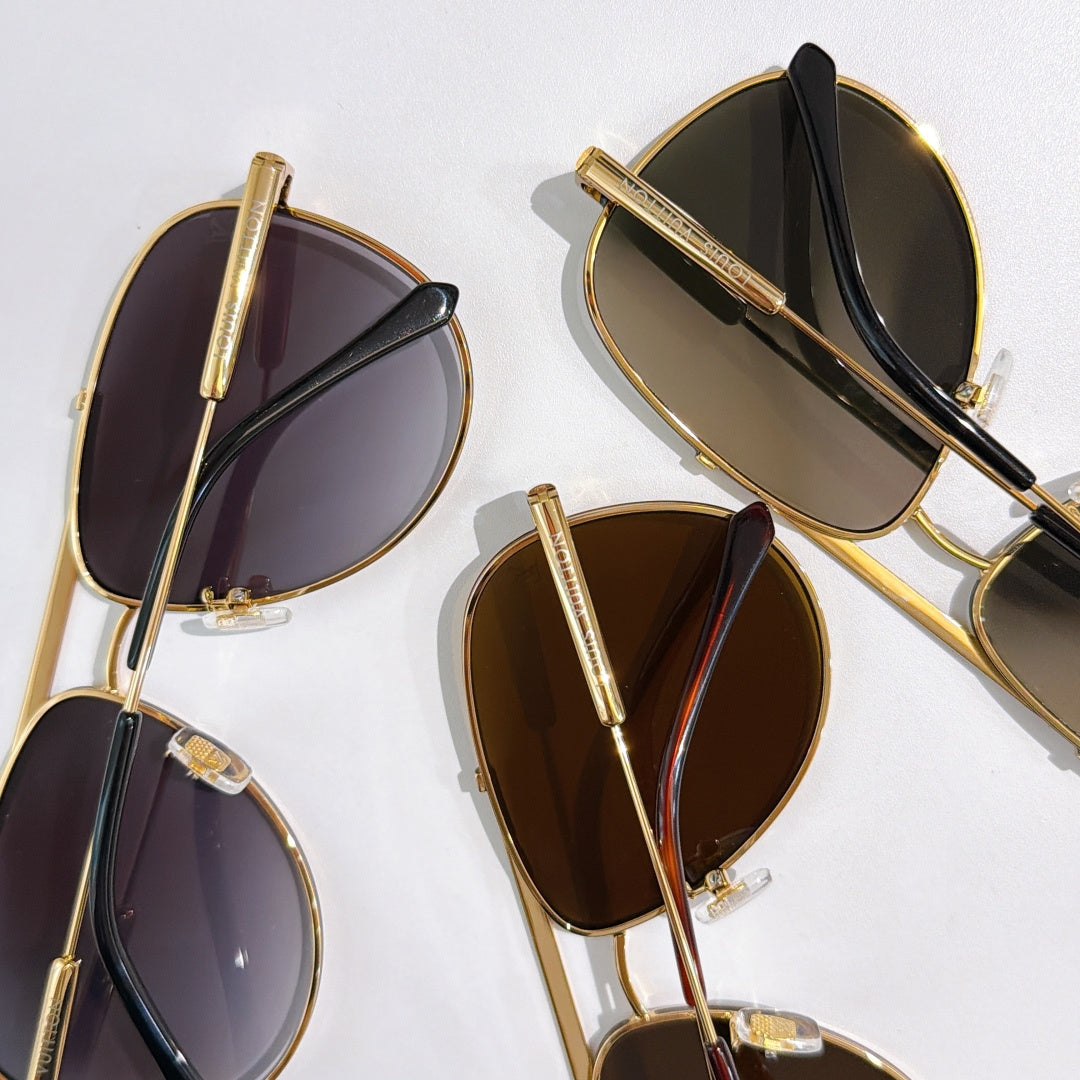 Set of Louis Vuitton sunglasses with gold frames and mixed dark lenses