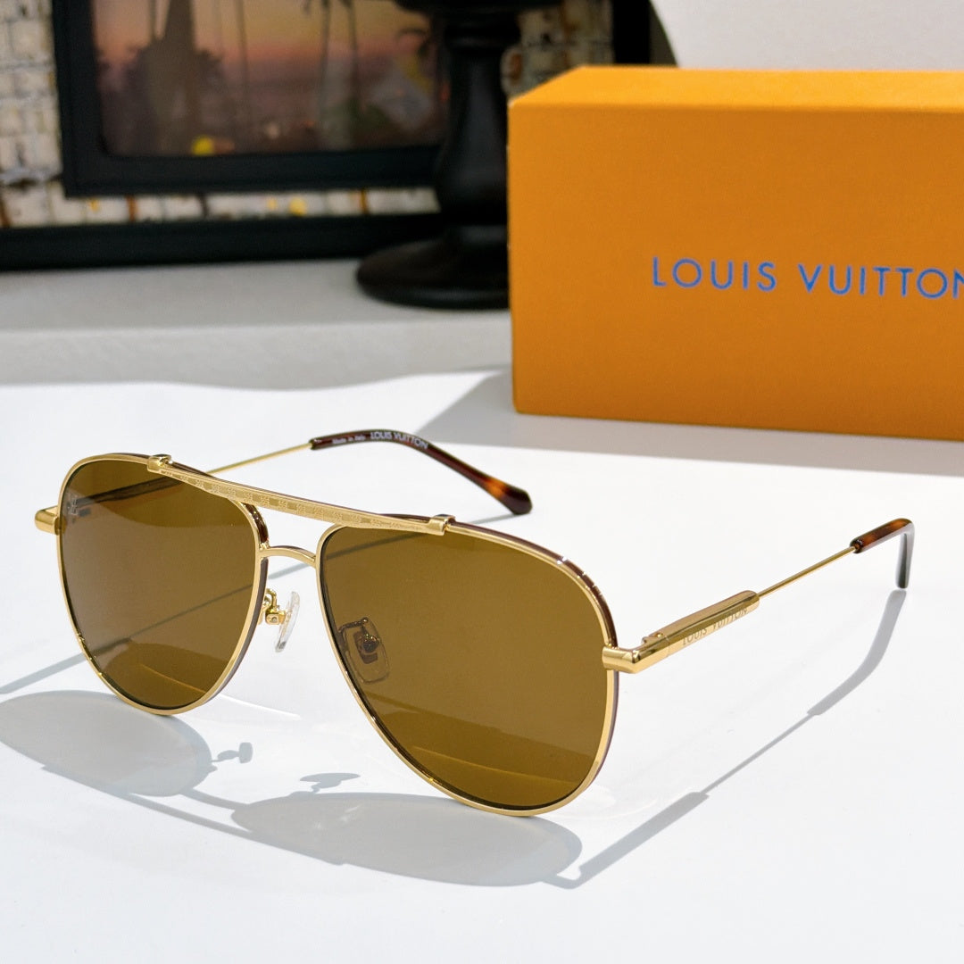 Louis Vuitton sunglasses with gold frame and amber gradient lenses