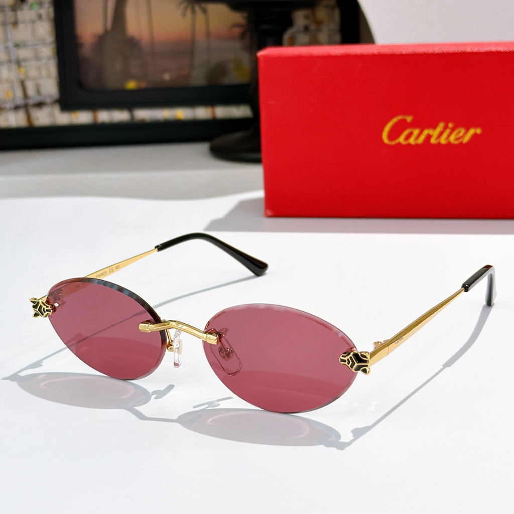 Cartier round sunglasses with gold frame and pink tinted lenses, black arms.