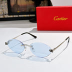 Cartier round sunglasses with silver frame, light blue tinted lenses, black arms.