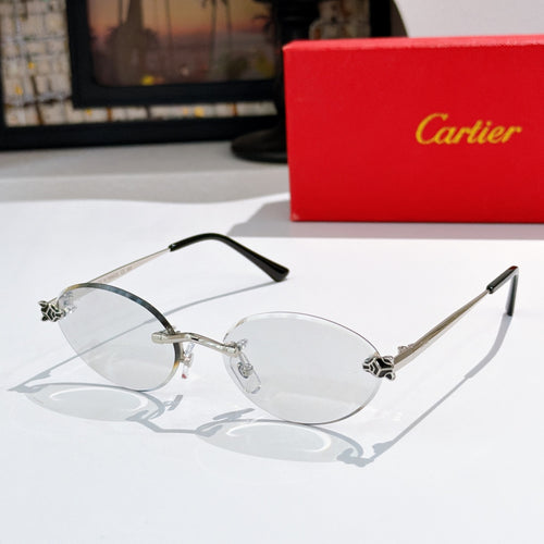 Cartier round sunglasses with silver-toned frame, light lenses, black-tipped arms.