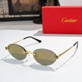 Cartier round sunglasses with black arms and gold frame, olive tinted lenses.