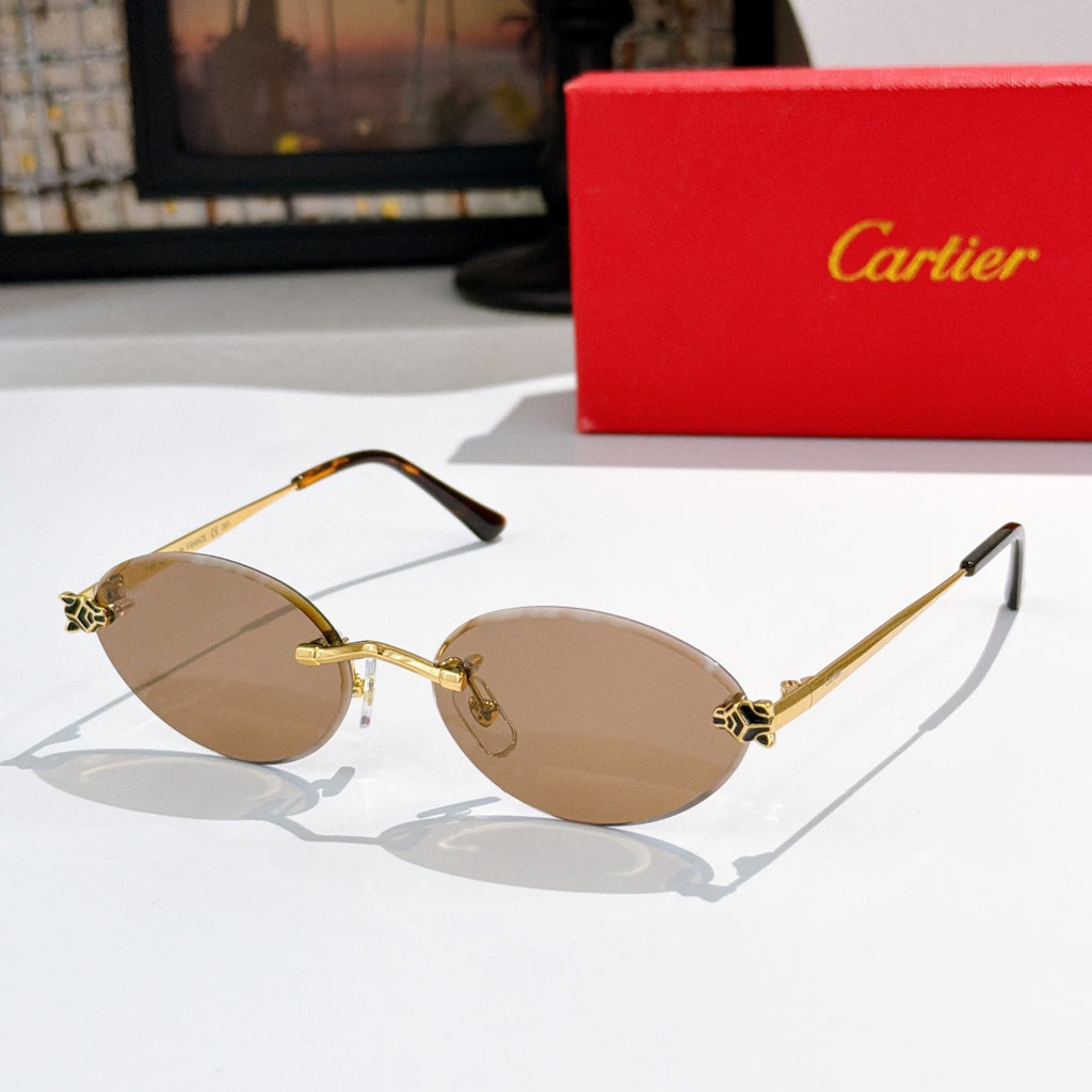 Cartier round sunglasses with gold frame and tan lenses, black arms.