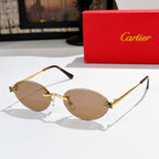 Cartier round sunglasses with gold frame and tan lenses, black arms.
