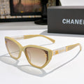 Chanel cat-eye sunglasses, light yellow frame, clear lenses