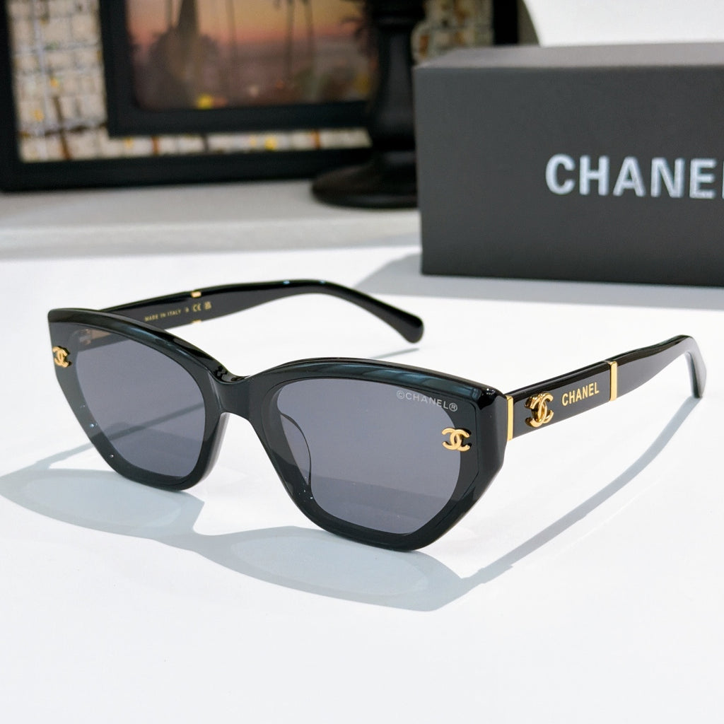 Chanel cat-eye sunglasses, black frame, dark tinted lenses