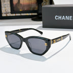 Chanel cat-eye sunglasses, black frame, dark tinted lenses